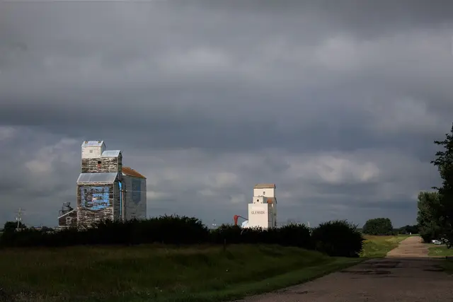 Grain elevators under stormy sky